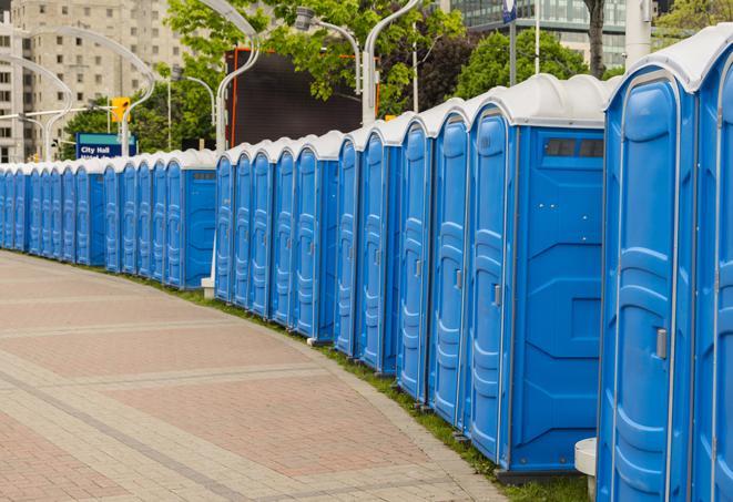 a line of portable restrooms at an outdoor wedding, catering to guests with style and comfort in Essex Fells, NJ